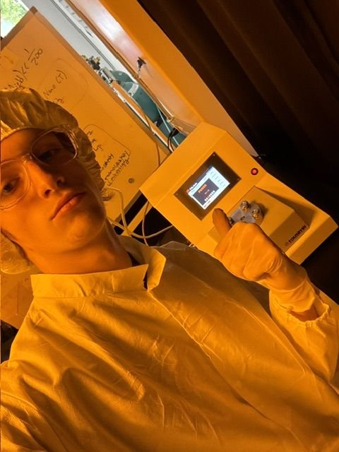Wilson operating the critical point dryer in a cleanroom gown